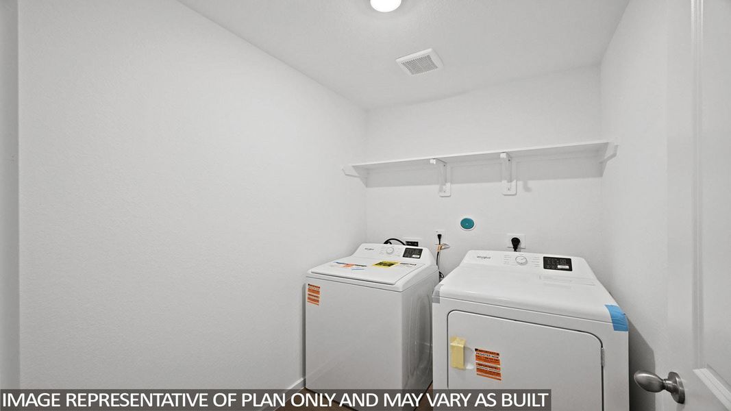 Laundry room featuring washing machine and clothes dryer