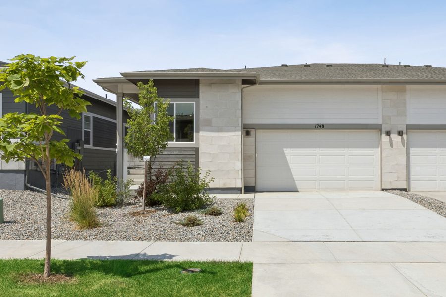 Front exterior of a new home in Westside Crossing, Berthoud, CO, highlighting curb appeal (Image 1). Front exterior of a new home in Westside Crossing, Berthoud, CO, highlighting curb appeal (Image 1).