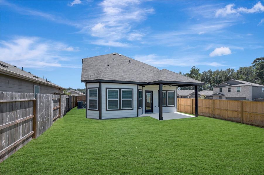 Exterior details and patio area of a home in Pinewood at Grand Texas, New Caney (Image 17). Exterior details and patio area of a home in Pinewood at Grand Texas, New Caney (Image 17).