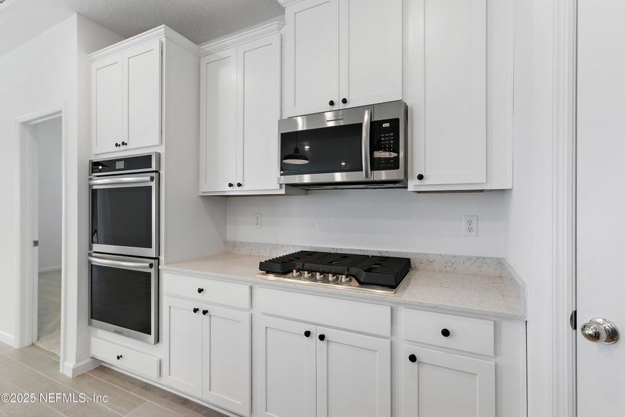Furnished interior view inside a new home in Tributary: Lakeview at Tributary 50's, Yulee (Image 3).