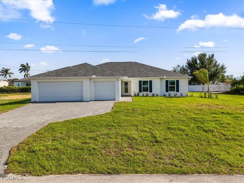 Front exterior of a new home in Cape Coral, Cape Coral, FL, highlighting curb appeal (Image 22).