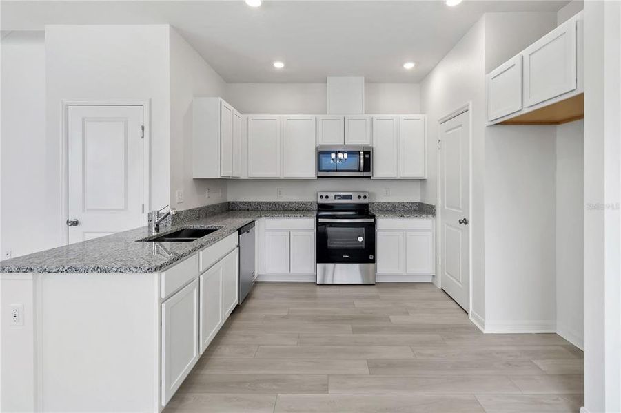 Furnished interior view inside a new home in Bellaviva III at Westside, Davenport (Image 6).