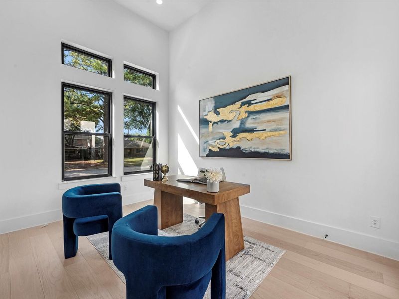 A private home office with elegant French doors that open directly to your serene courtyard retreat.