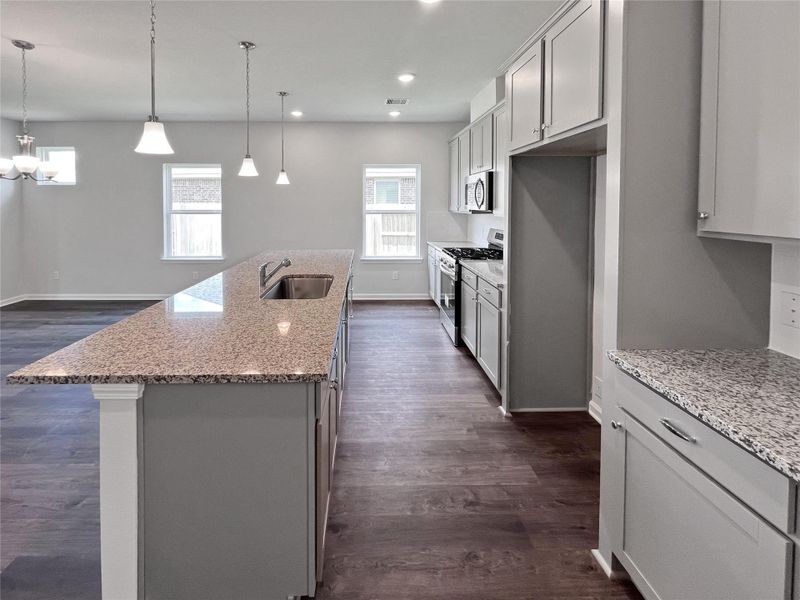 The Crawford- Kitchen. Home under construction. Sample floor plan photo used for illustrative purposes only. Upgrades, selections options, windows and colors may vary. The Crawford- Kitchen. Home under construction. Sample floor plan photo used for illustrative purposes only. Upgrades, selections options, windows and colors may vary.