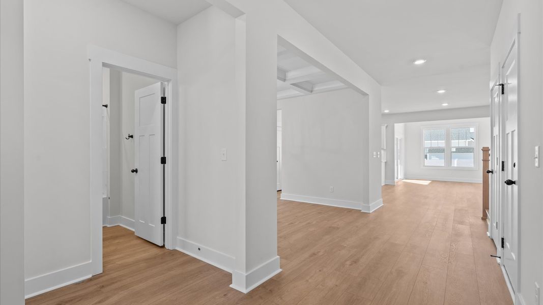 Refined foyer with hardwood floors and thoughtful design for a first-rate welcome Refined foyer with hardwood floors and thoughtful design for a first-rate welcome