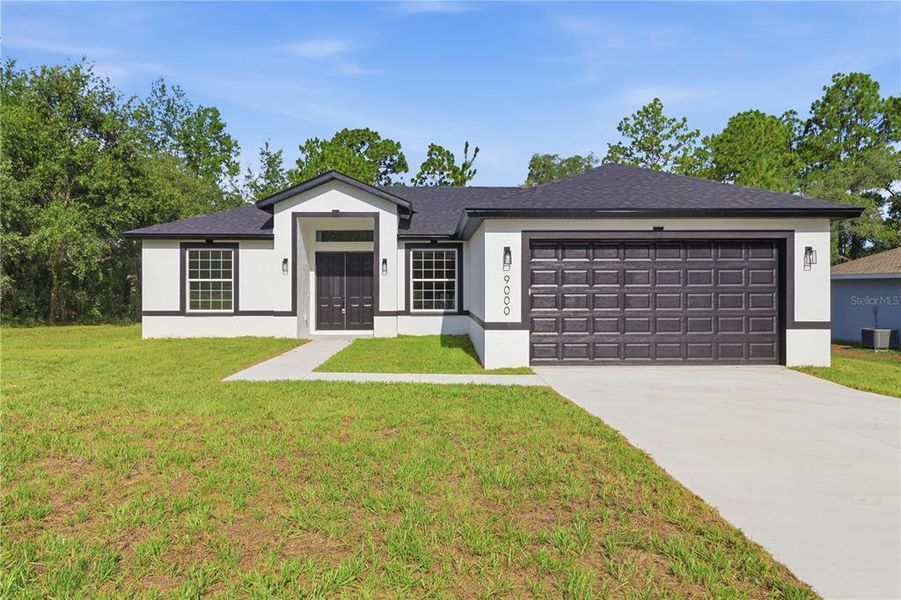 Front exterior of a new home in , Citrus Springs, FL, highlighting curb appeal (Image 22). Front exterior of a new home in , Citrus Springs, FL, highlighting curb appeal (Image 22).