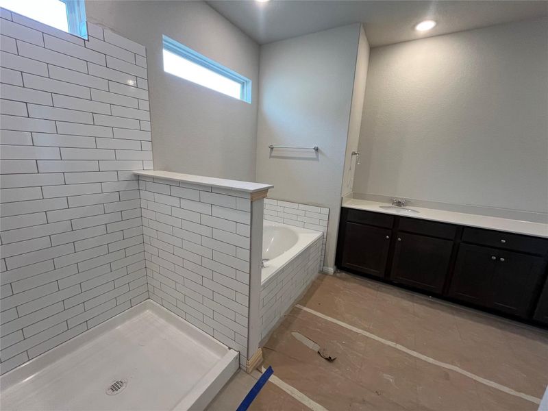 In-progress construction of a new home in The Cottages at Lariat, Liberty Hill, TX (Image 24).