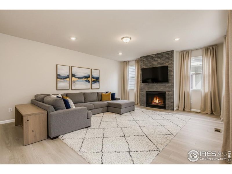 The cozy great room featuring a gas fireplace