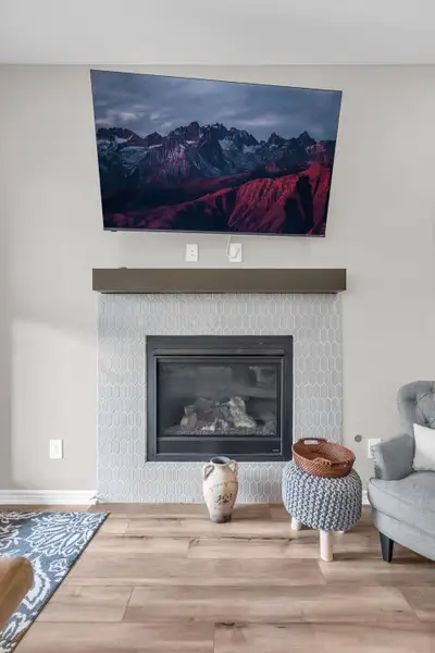 This beautiful custom gas log fireplace/wood mantle is a centerpiece in the main living area. This beautiful custom gas log fireplace/wood mantle is a centerpiece in the main living area.