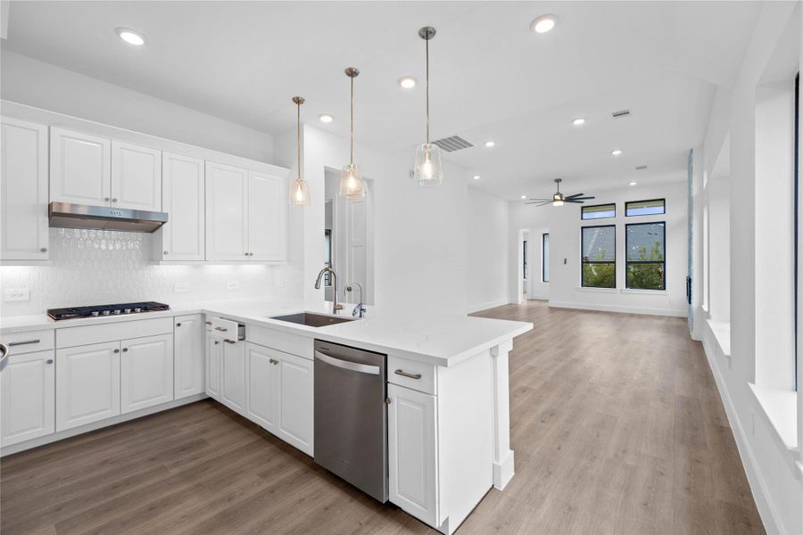 Stunning open-concept design seamlessly connecting the living, dining, and kitchen areas—perfect for both everyday living and entertaining!