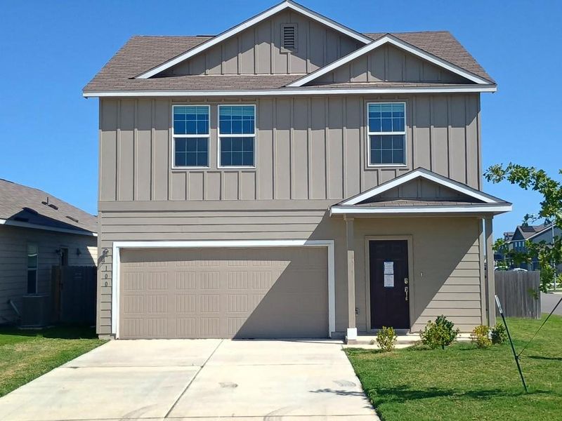 View of front facade with board and batten siding, a shingled roof, an attached garage, and driveway View of front facade with board and batten siding, a shingled roof, an attached garage, and driveway