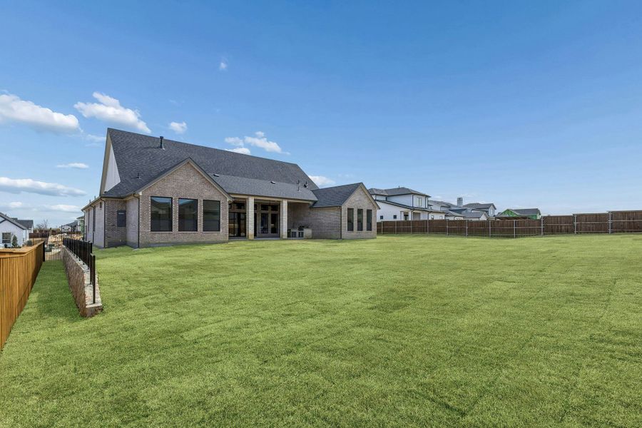 Exterior details and patio area of a home in The Vines, Haslet (Image 26).