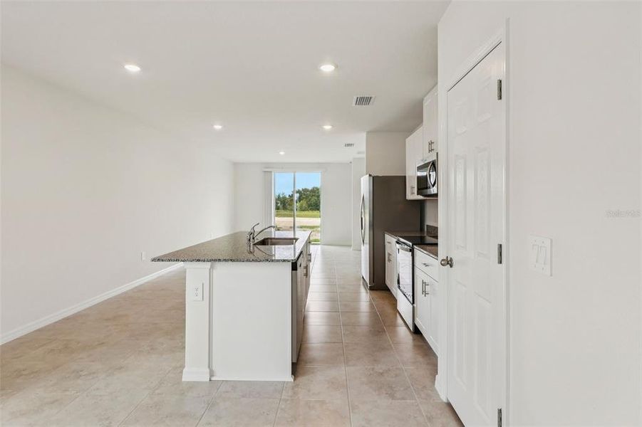 Furnished interior view inside a new home in Bradbury Creek - Classic Series, Haines City (Image 14).