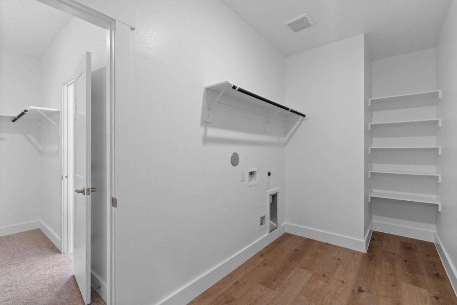 Whether you're sorting through the week’s clothes or prepping for a family gathering, this laundry room is designed to be a cheerful and functional part of your home, where every wash feels like a fresh start.