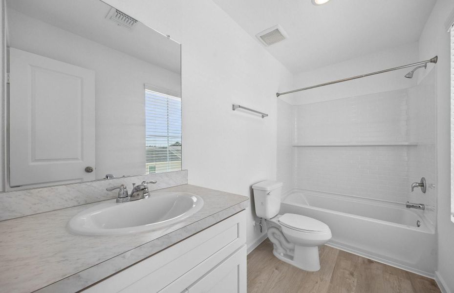Furnished interior view inside a new home in The Courtyards at Stokesbury, Waller (Image 6).