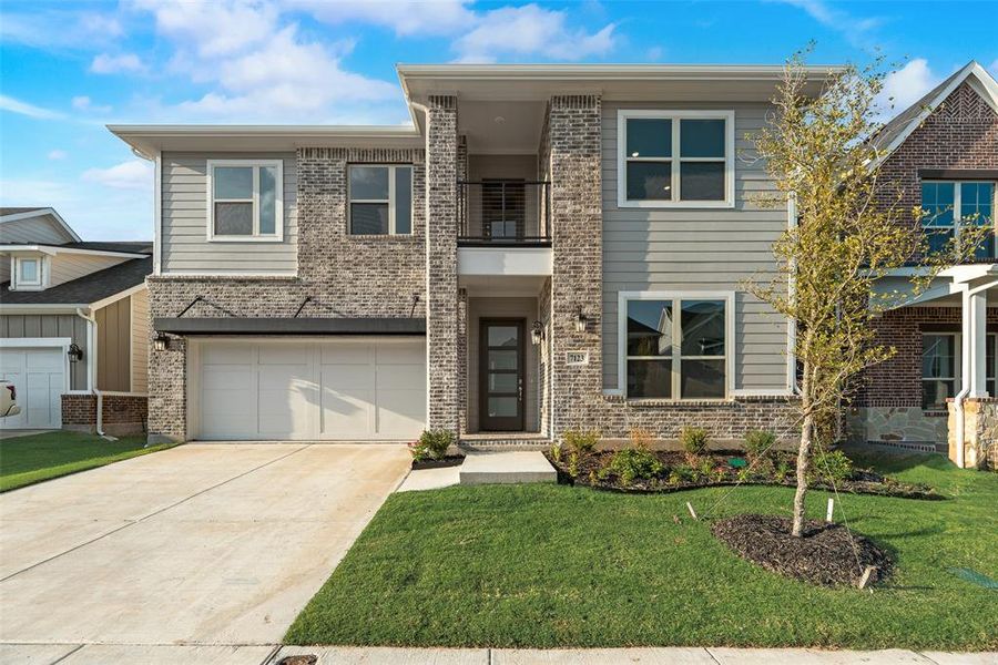 Front exterior of a new home in Bayside, Rowlett, TX, highlighting curb appeal (Image 16). Front exterior of a new home in Bayside, Rowlett, TX, highlighting curb appeal (Image 16).