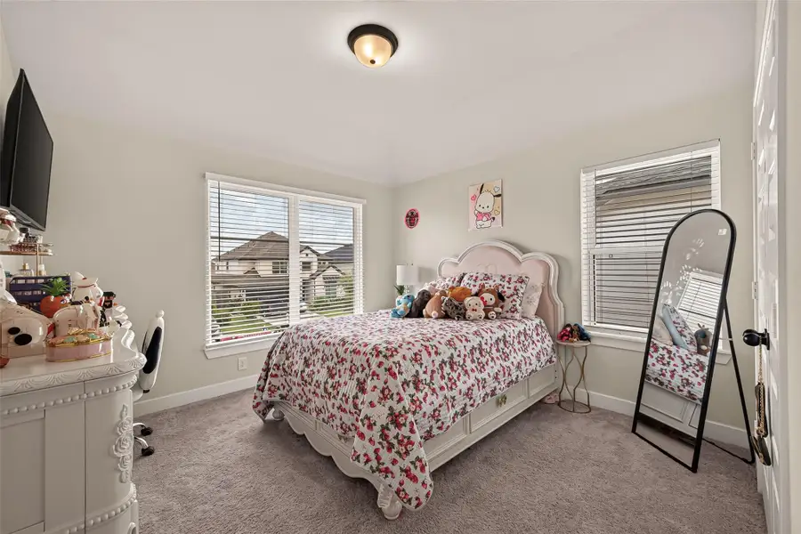 Comfortable secondary bedroom with plenty of natural light Comfortable secondary bedroom with plenty of natural light