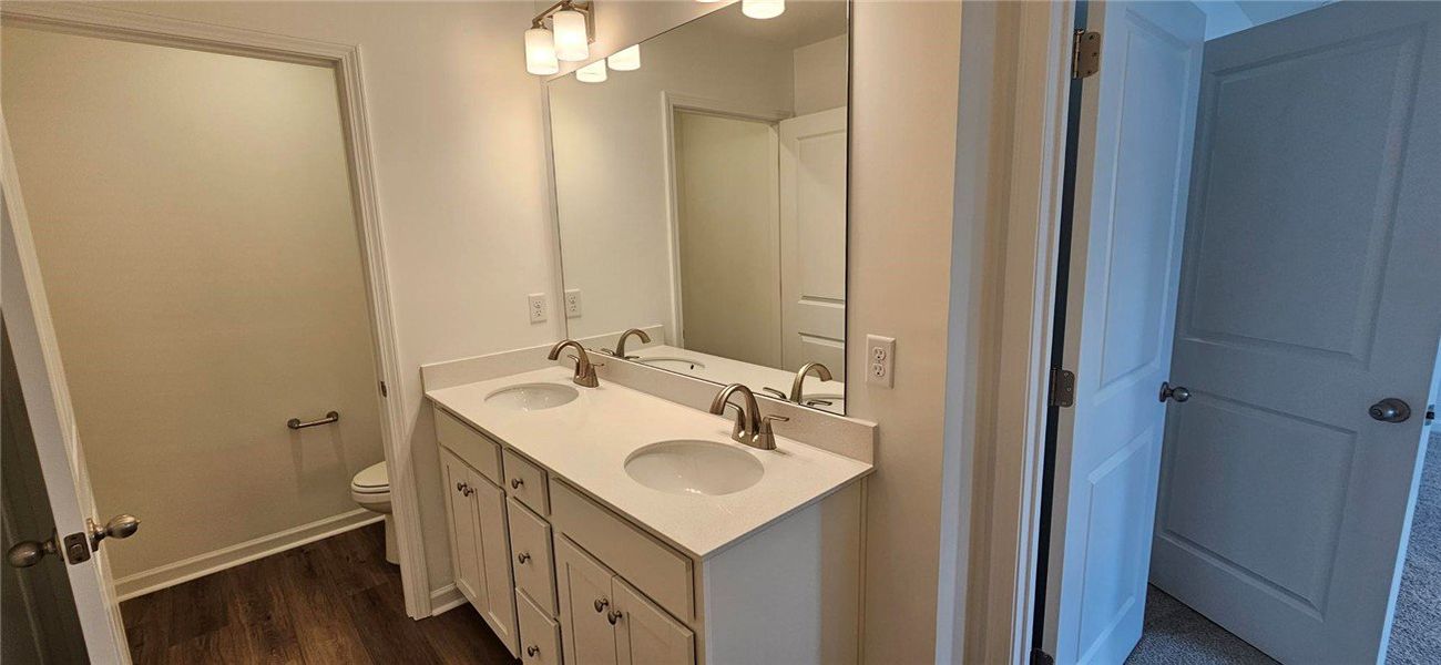 This spacious bathroom features a double vanity an This spacious bathroom features a double vanity an