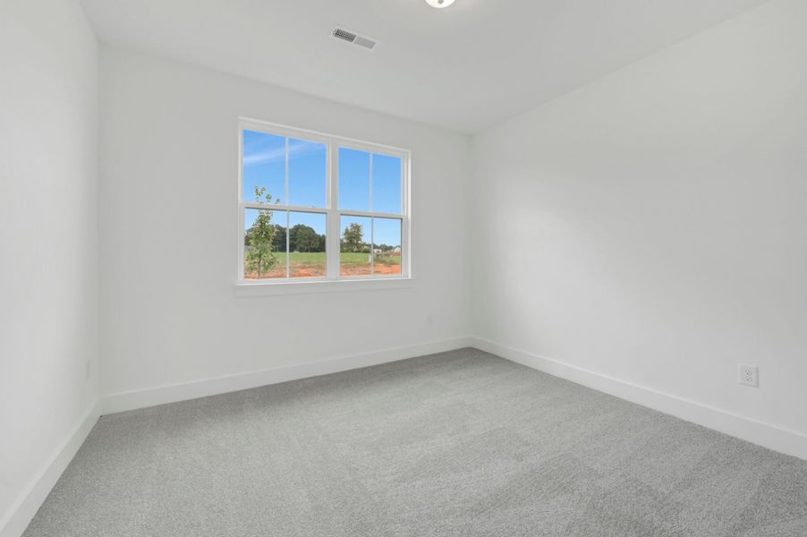 Spacious, unfurnished interior of a new home in McAlister Creek, Clayton (Image 26).