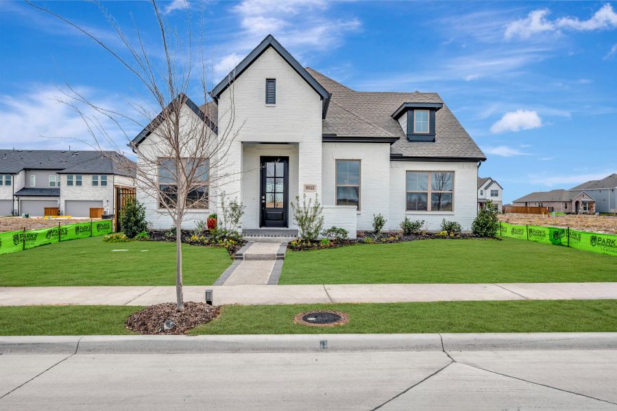 Front exterior of a new home in Talia – Garden Series, Mesquite, TX, highlighting curb appeal (Image 1). Front exterior of a new home in Talia – Garden Series, Mesquite, TX, highlighting curb appeal (Image 1).