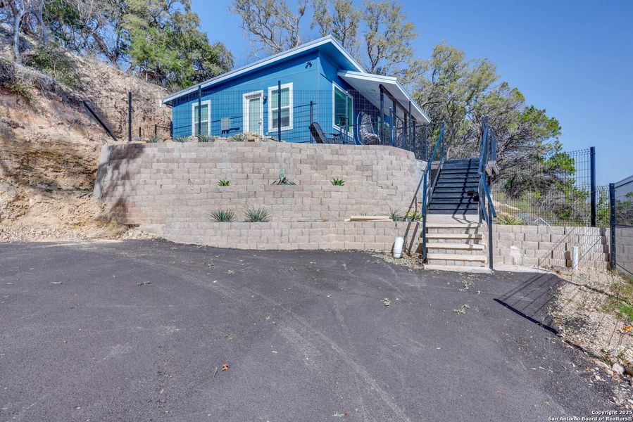 Front exterior of a new home in , Canyon Lake, TX, highlighting curb appeal (Image 19).
