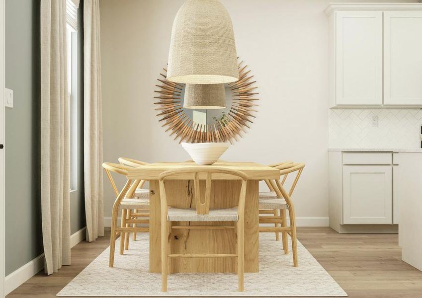 Rendering of the dining room nestled next
  to the kitchen. The room is furnished with a six-person table, rug and round
  mirror. A window provides natural light to the space.