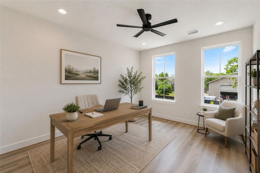 Third bedroom currently staged as a home office, offering flexible living and work from home options.