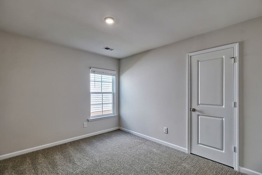 Representative unfurnished interior of a home built from the Juniper by McGuinn Homes in Hunters Branch, Hopkins (Image 15).