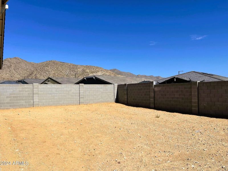 VIEWS OF WHITE TANKS AND ONE-STORY HOMES