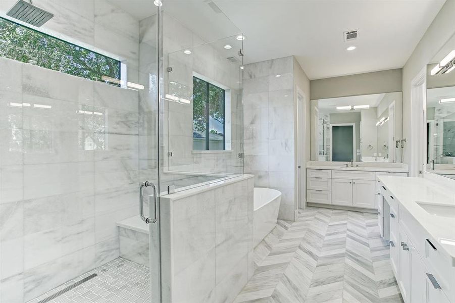 What an incredibly fabulous master bathroom! The designer selected marble walls are from floor to ceiling.