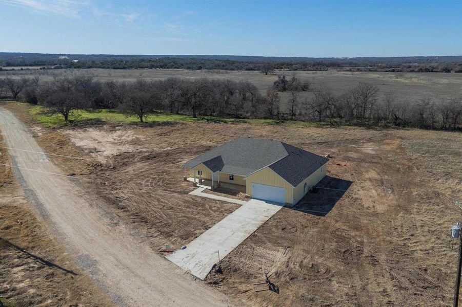 Birds eye view of property with a rural view