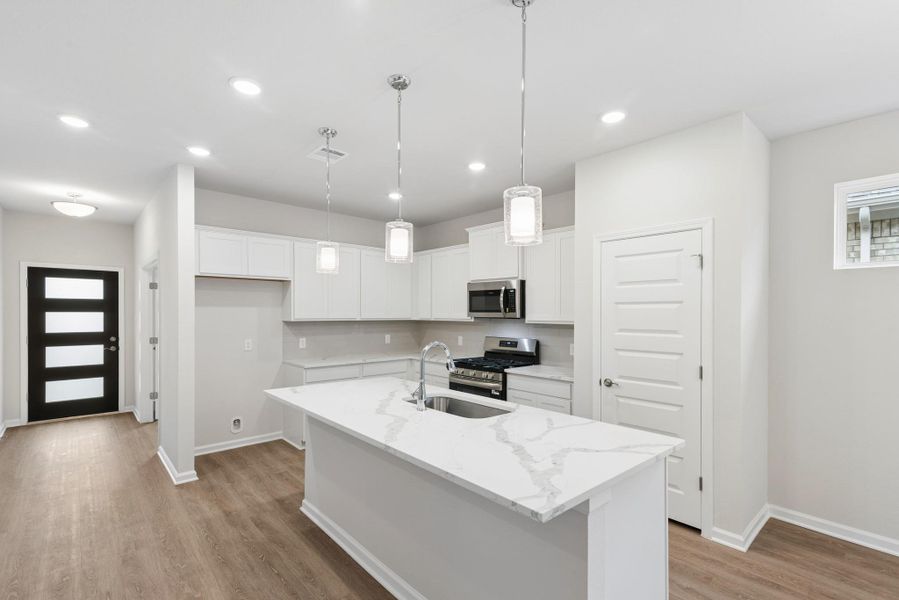 The Oakshire II- Kitchen with Island. Sample image for illustration; upgrades, options, and colors may vary. The Oakshire II- Kitchen with Island. Sample image for illustration; upgrades, options, and colors may vary.