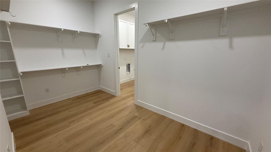 Primary closet, connects to laundry room