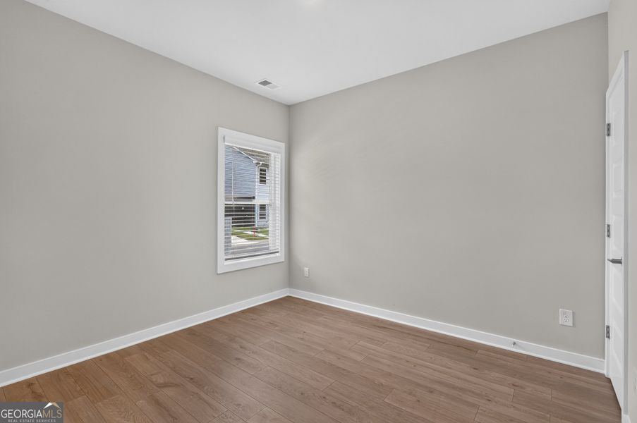 Spacious, unfurnished interior of a new home in The Cottages at East Lanier, Fayetteville (Image 19).