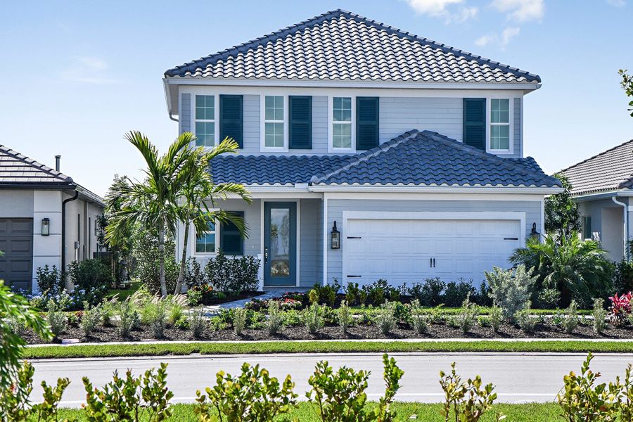 Representative exterior photo of a completed home built from the Heritage by Neal Communities in SkySail, Naples, FL (Image 19).