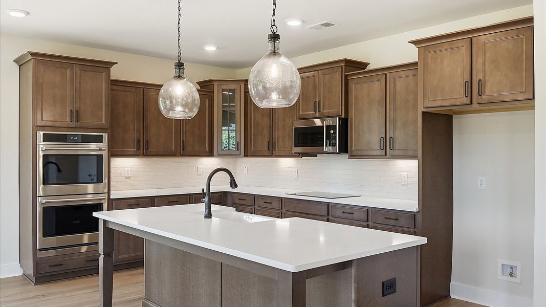 Accomplished layout with a first-class kitchen in this select community by DRB Homes