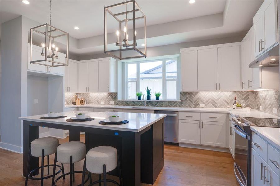 Martin Kitchen.This home is under construction, and this photo is of a similar home, but the finishes may differ.