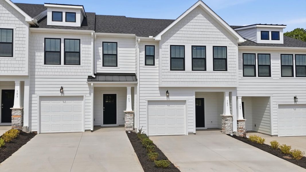 Front exterior of a new home in Gresham Station, Simpsonville, SC, highlighting curb appeal (Image 2). Front exterior of a new home in Gresham Station, Simpsonville, SC, highlighting curb appeal (Image 2).