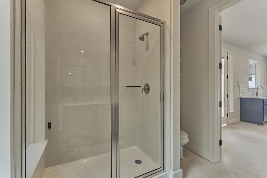 Casita bathroom featuring a sleek walk-in shower, modern fixtures, and easy access to the private living and kitchenette area—perfect for guest comfort and convenience.