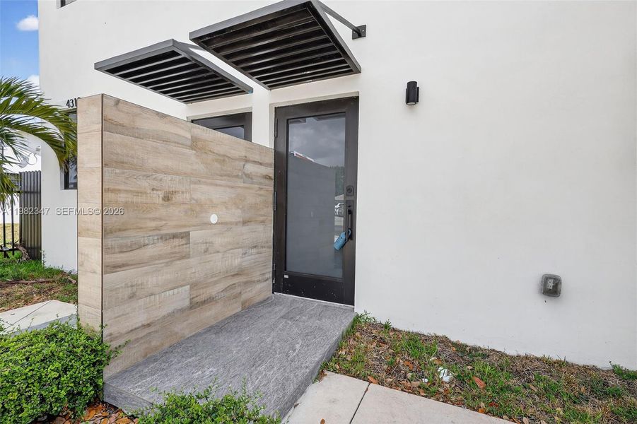Exterior details and patio area of a home in , Miami (Image 3).