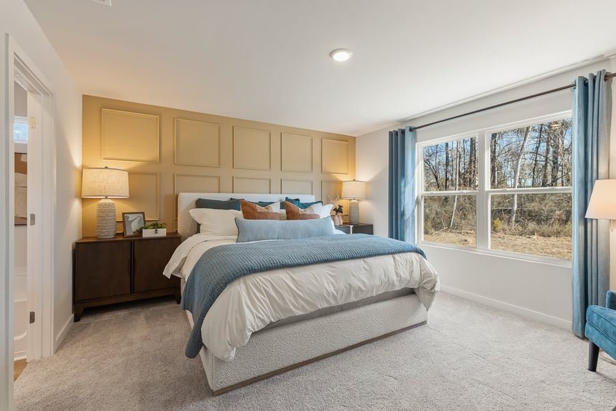 A bedroom with a bed and lamps. A bedroom with a bed and lamps.