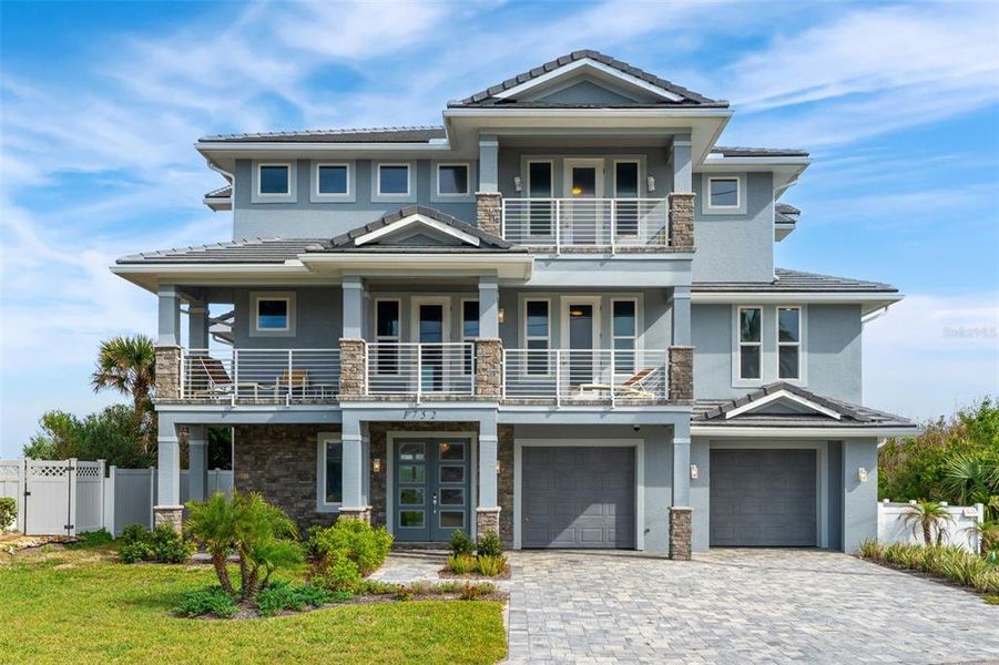 Front exterior of a new home in , Flagler Beach, FL, highlighting curb appeal (Image 1). Front exterior of a new home in , Flagler Beach, FL, highlighting curb appeal (Image 1).
