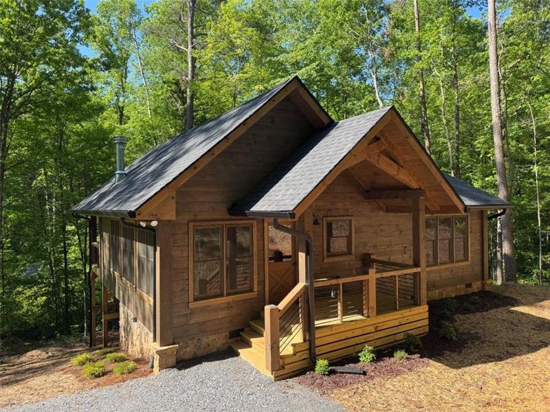 Front exterior of a new home in , Cherry Log, GA, highlighting curb appeal (Image 1). Front exterior of a new home in , Cherry Log, GA, highlighting curb appeal (Image 1).