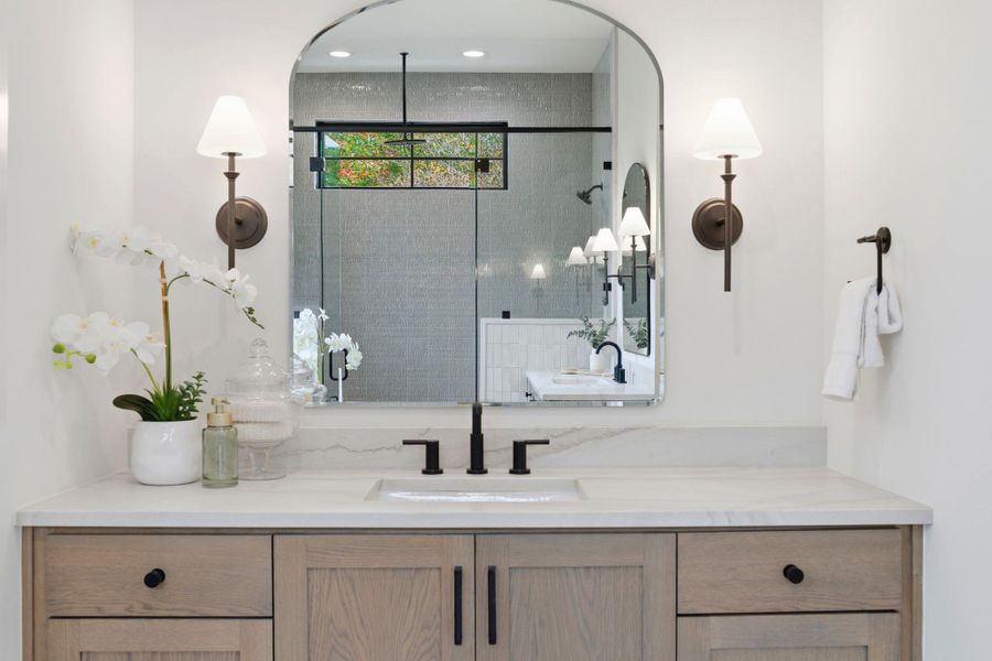 Full bathroom featuring vanity and a shower stall