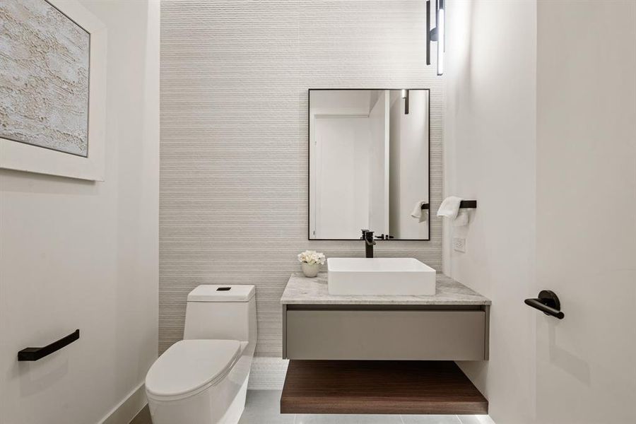 Spa-inspired bathroom with floating vanity and modern fixtures. Spa-inspired bathroom with floating vanity and modern fixtures.