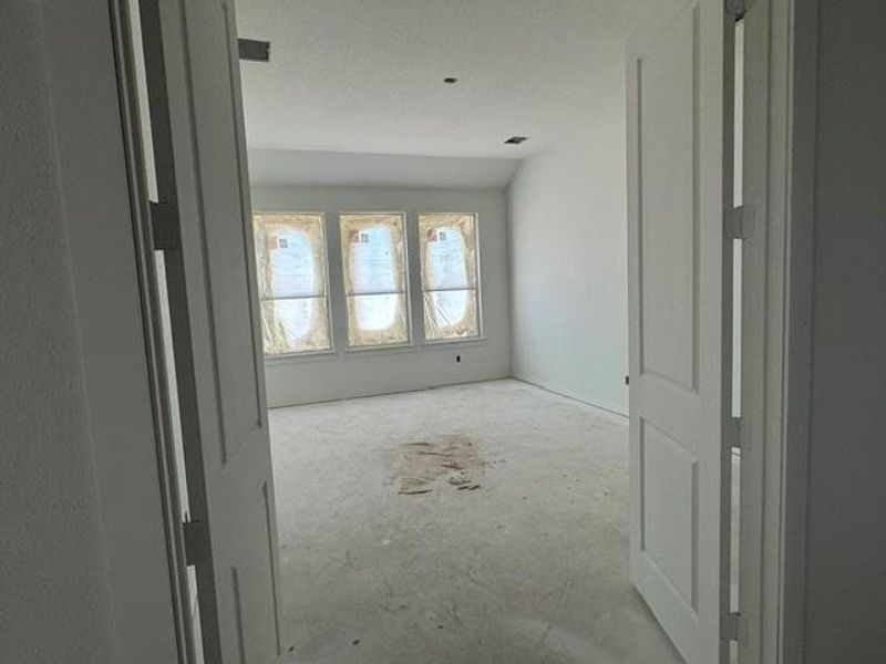 An inviting room awaits finishing touches, offering abundant natural light through multiple windows. An inviting room awaits finishing touches, offering abundant natural light through multiple windows.