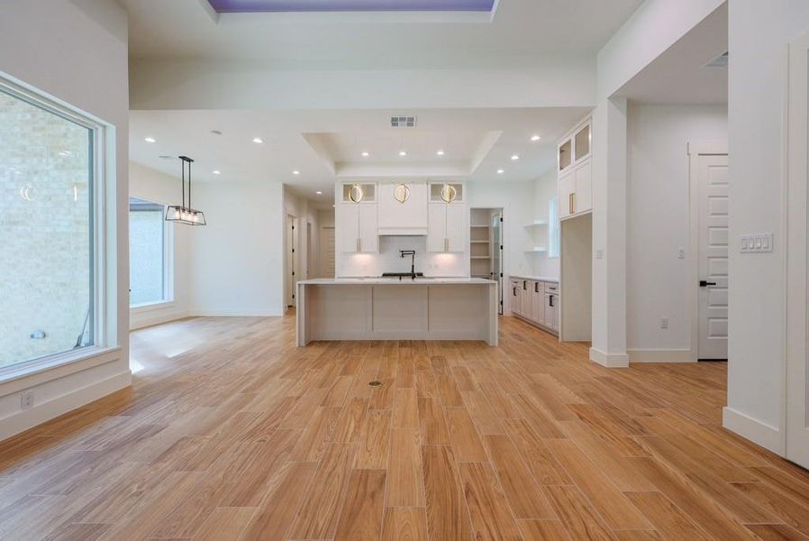 Matte black and gold finishes with fully custom cabinetry not only in the kitchen but throughout the entire home.