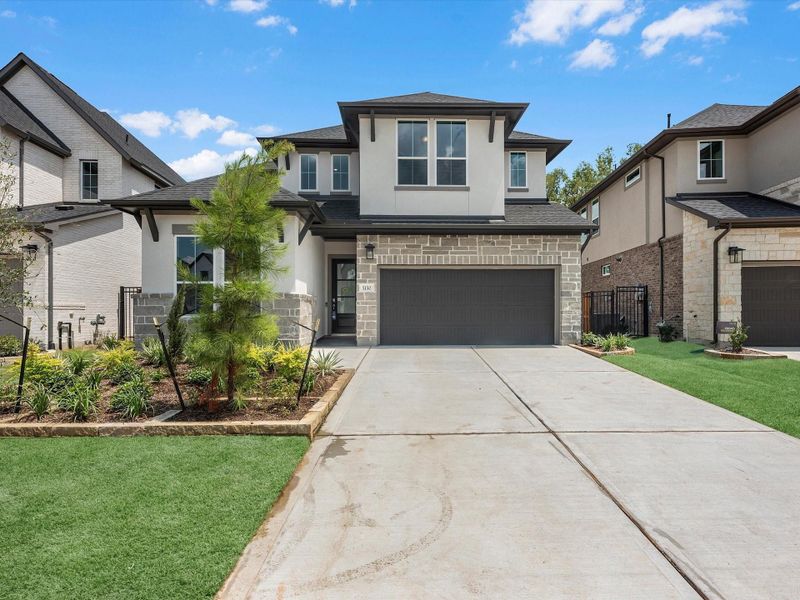 Front exterior of a new home in Woodson’s Reserve, Spring, TX, highlighting curb appeal (Image 2). Front exterior of a new home in Woodson’s Reserve, Spring, TX, highlighting curb appeal (Image 2).