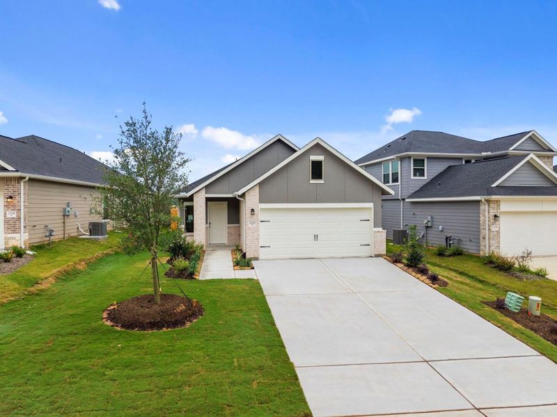 Front exterior of a new home in Westridge Cove, Conroe, TX, highlighting curb appeal (Image 19).