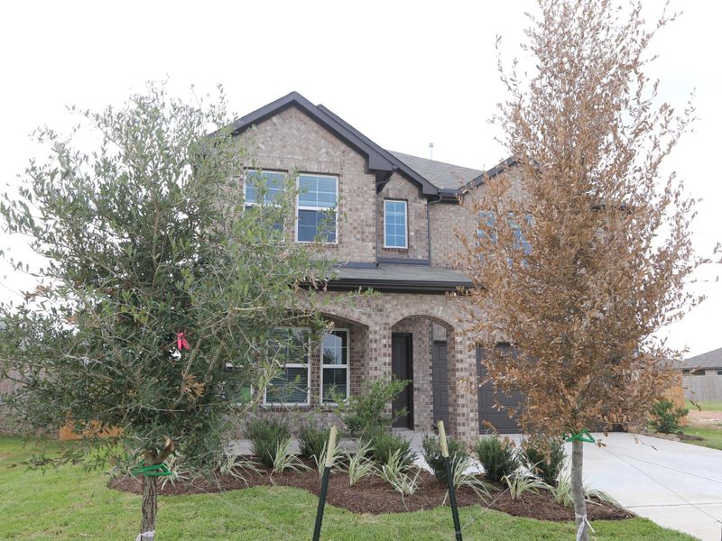 Front exterior of a new home in Miller's Pond, Rosenberg, TX, highlighting curb appeal (Image 2). Front exterior of a new home in Miller's Pond, Rosenberg, TX, highlighting curb appeal (Image 2).